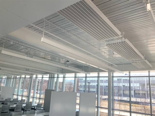 A strip of Frengers top of the line radiant passive chilled beams installed inside the newly built Siebel Design Centre